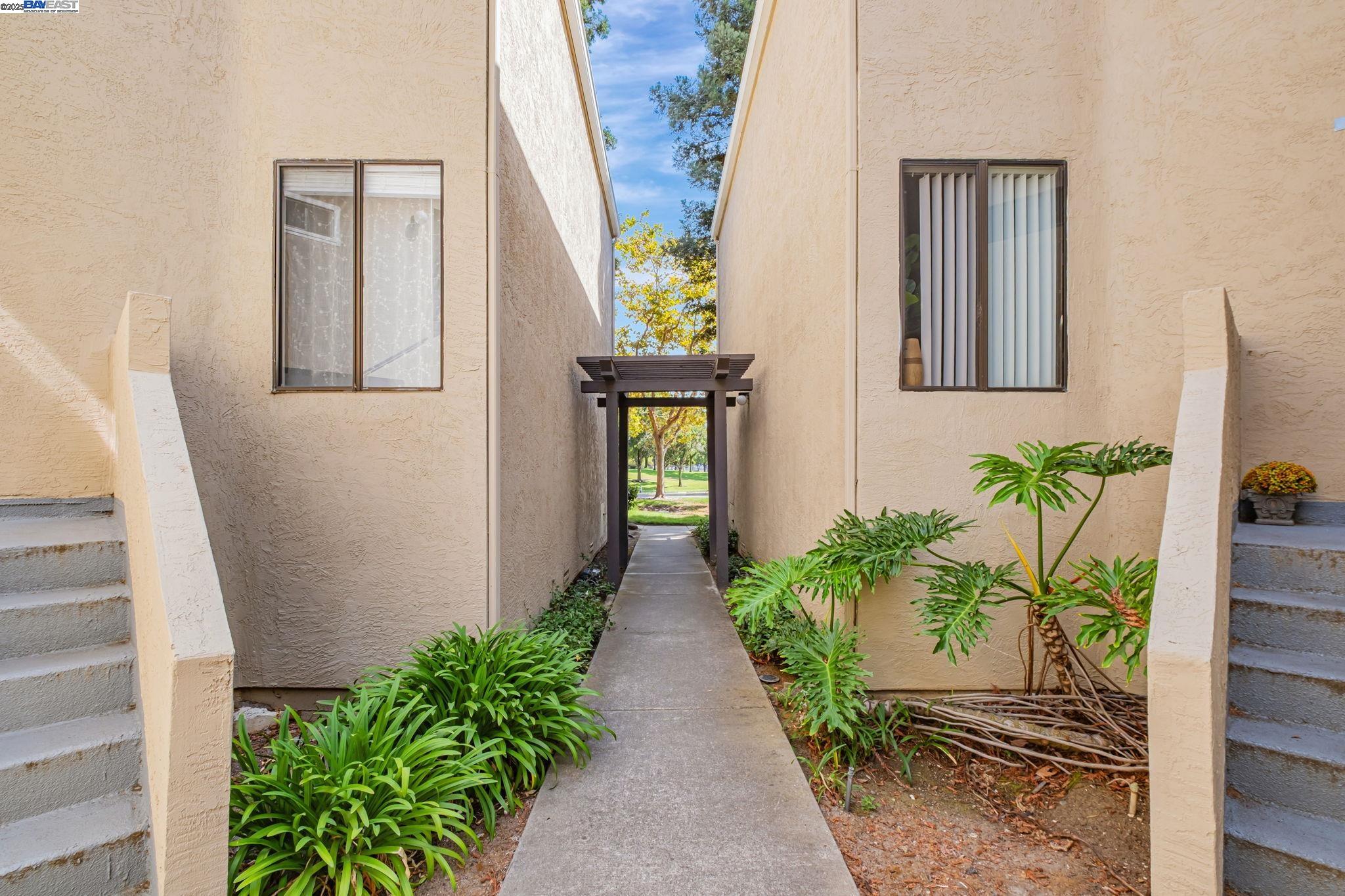 1960 Barrymore Common, Unit K Fremont, CA 94538 - Photo 26 of 31 a view of a entryway with flower pots