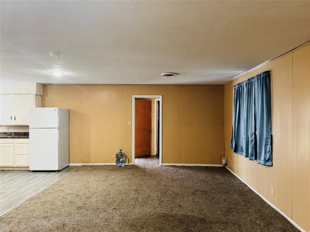 306 North Ave D Haskell, TX 79521 - Photo 3 of 7 a view of a livingroom with a kitchen