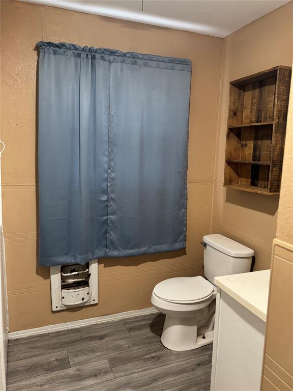 306 North Ave D Haskell, TX 79521 - Photo 6 of 7 a bathroom with a toilet and a shower