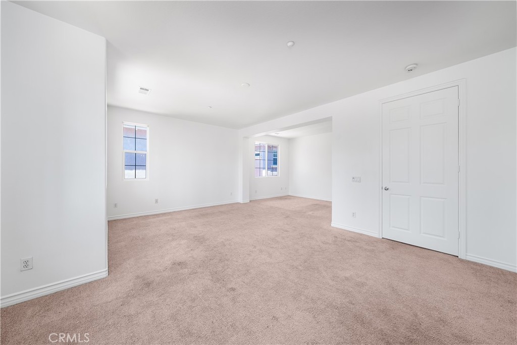 5662 Galasso Avenue Fontana, CA 92336 - Photo 19 of 34 an empty room with an entryway