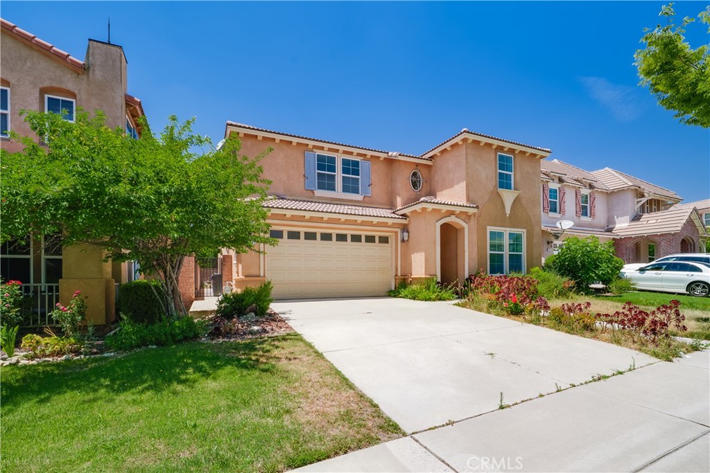 5662 Galasso Avenue Fontana, CA 92336 - Photo 2 of 34 a front view of a house with a yard