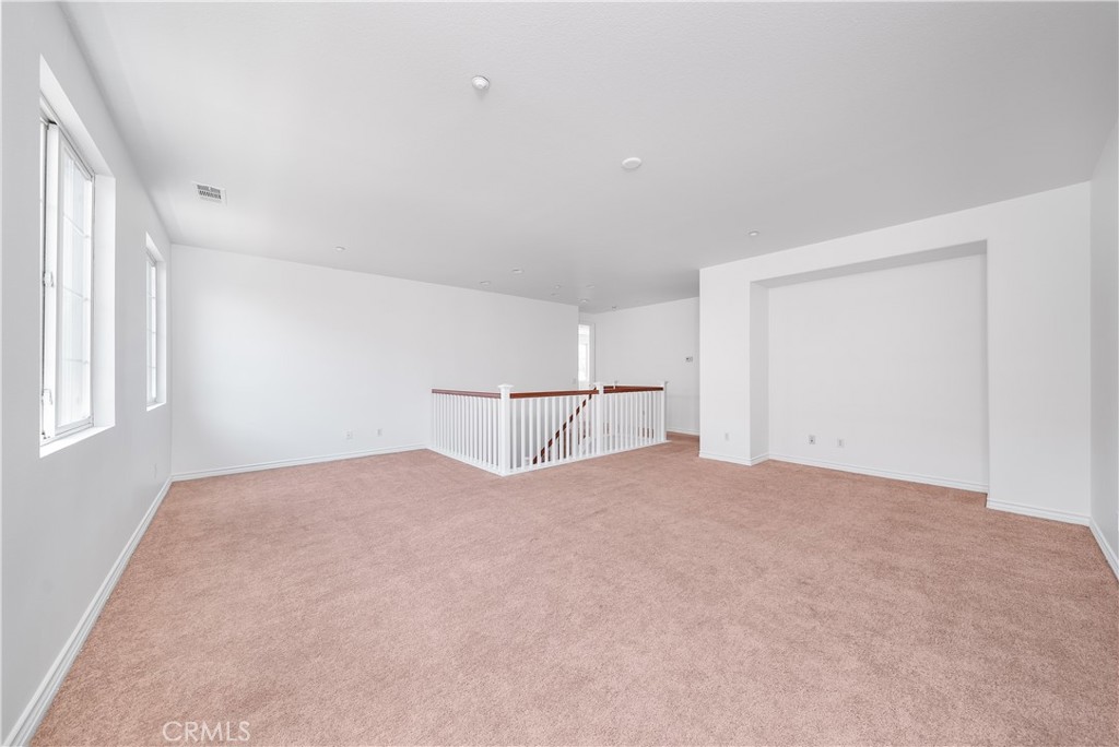 5662 Galasso Avenue Fontana, CA 92336 - Photo 21 of 34 a view of a room with a bed and a window