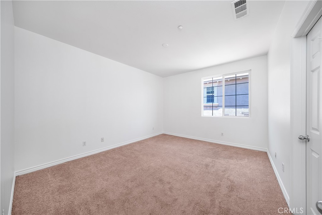 5662 Galasso Avenue Fontana, CA 92336 - Photo 22 of 34 an empty room with windows