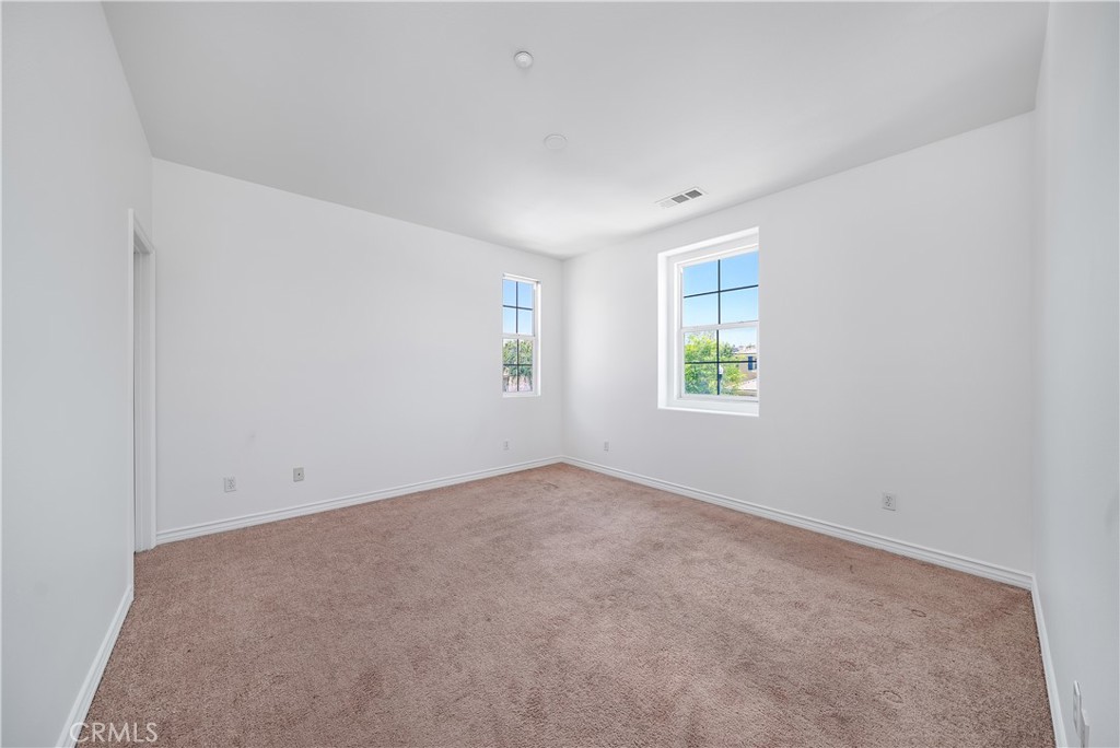 5662 Galasso Avenue Fontana, CA 92336 - Photo 23 of 34 an empty room with windows