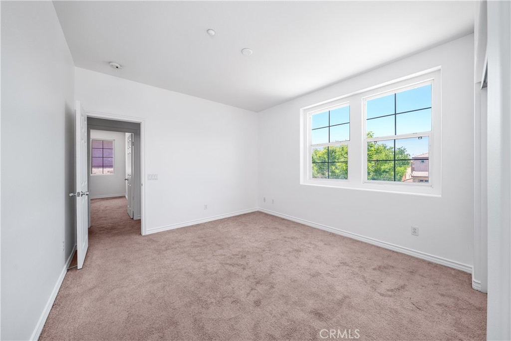 5662 Galasso Avenue Fontana, CA 92336 - Photo 26 of 34 an empty room with windows and closet