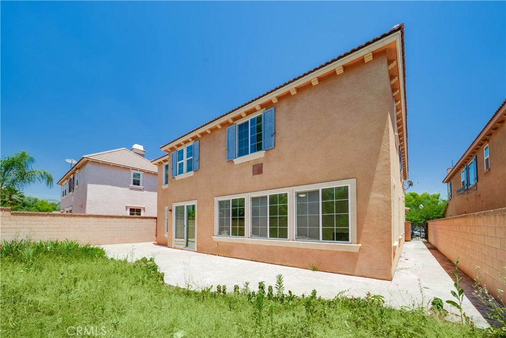 5662 Galasso Avenue Fontana, CA 92336 - Photo 29 of 34 a front view of a house with a yard