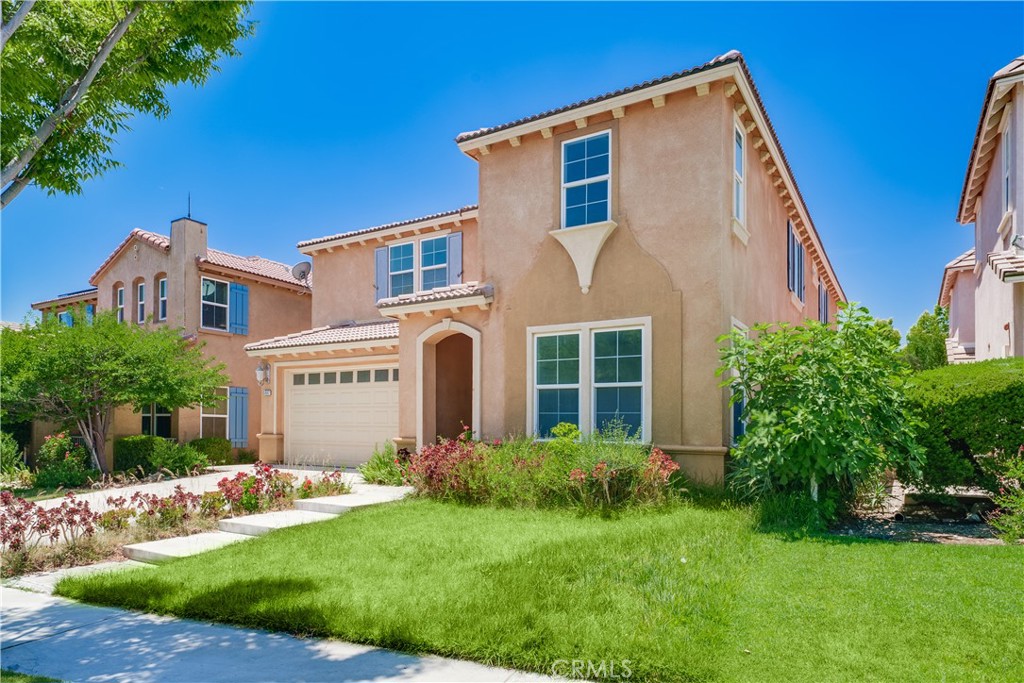 5662 Galasso Avenue Fontana, CA 92336 - Photo 3 of 34 a front view of a house with a yard