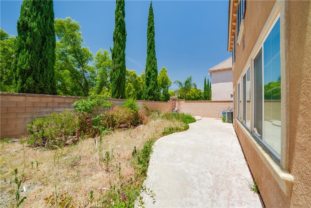 5662 Galasso Avenue Fontana, CA 92336 - Photo 32 of 34 a view of a pathway with a yard
