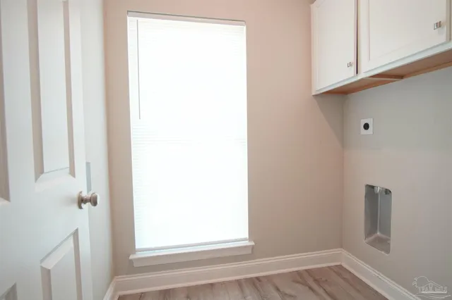 a view of front door with wooden floor