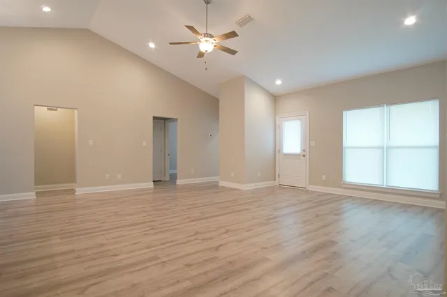 a view of an empty room with a window