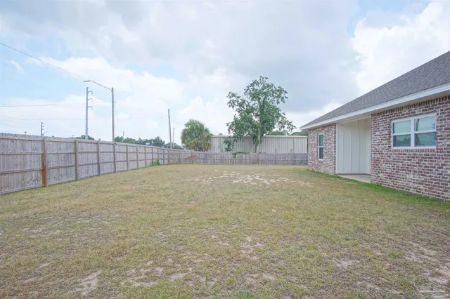 a view of outdoor space and backyard