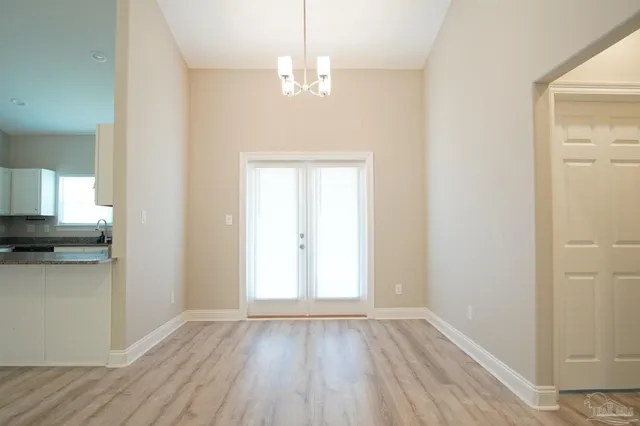 a view of a kitchen from the hallway