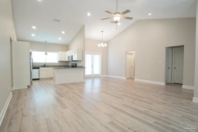 a view of kitchen with wooden floor and window