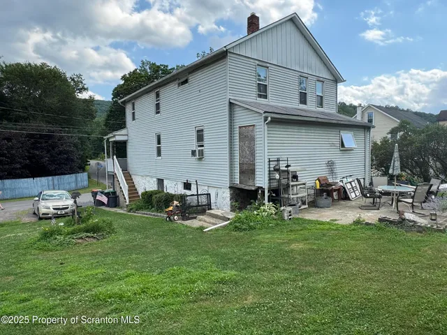 a front view of a house with patio