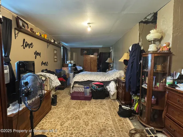 a bed room with furniture and gym equipment