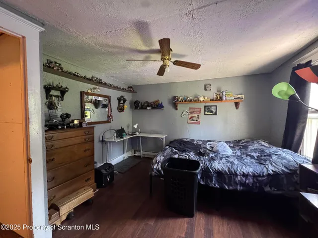 a bedroom with a bed and cabinets