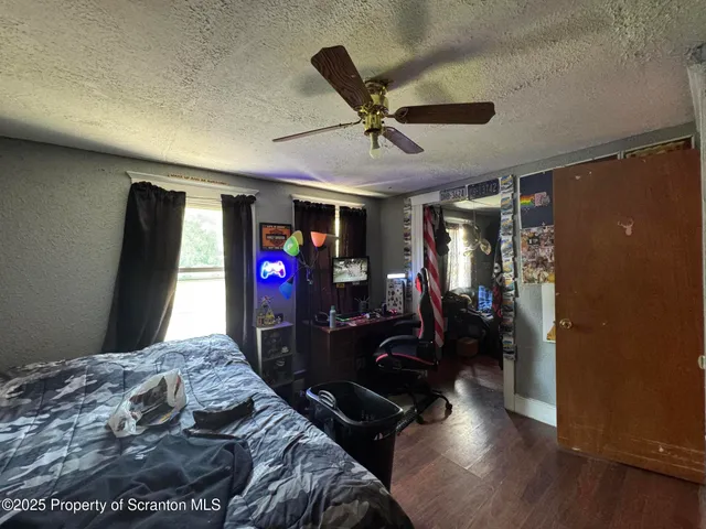 a bedroom with furniture and a window