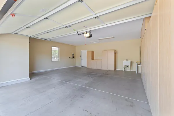 a kitchen with a refrigerator and a sink