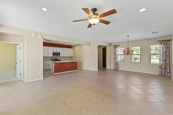 a view of a livingroom with a kitchen