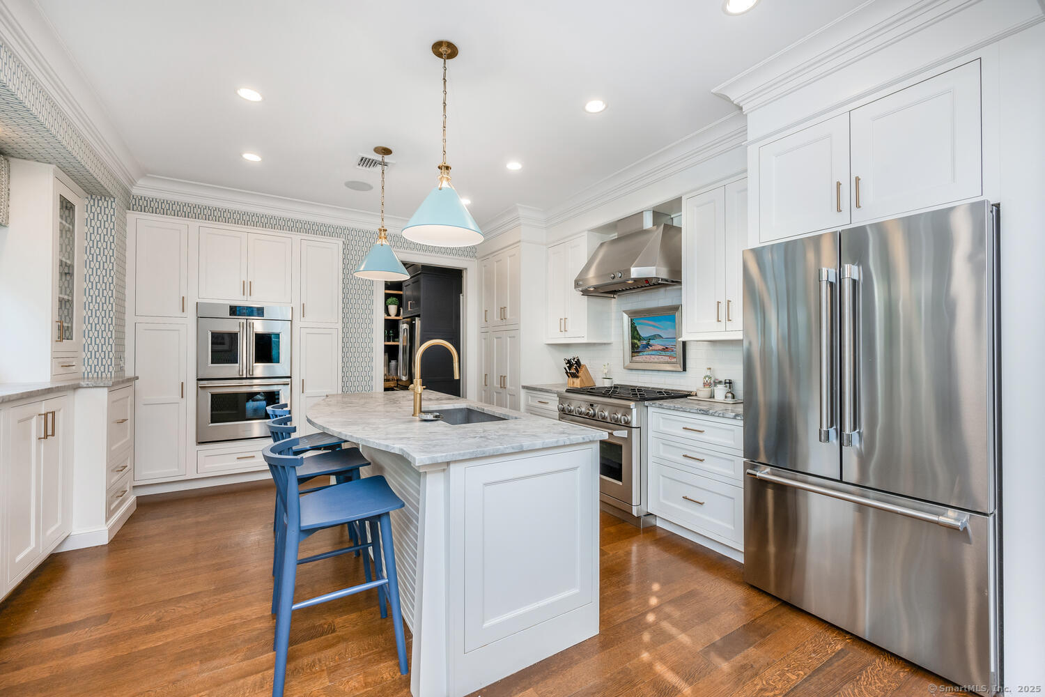 333 West Avenue, Unit 3 Darien, CT 06820 - Photo 11 of 38 a kitchen with stainless steel appliances a refrigerator a stove a sink a dining table and chairs