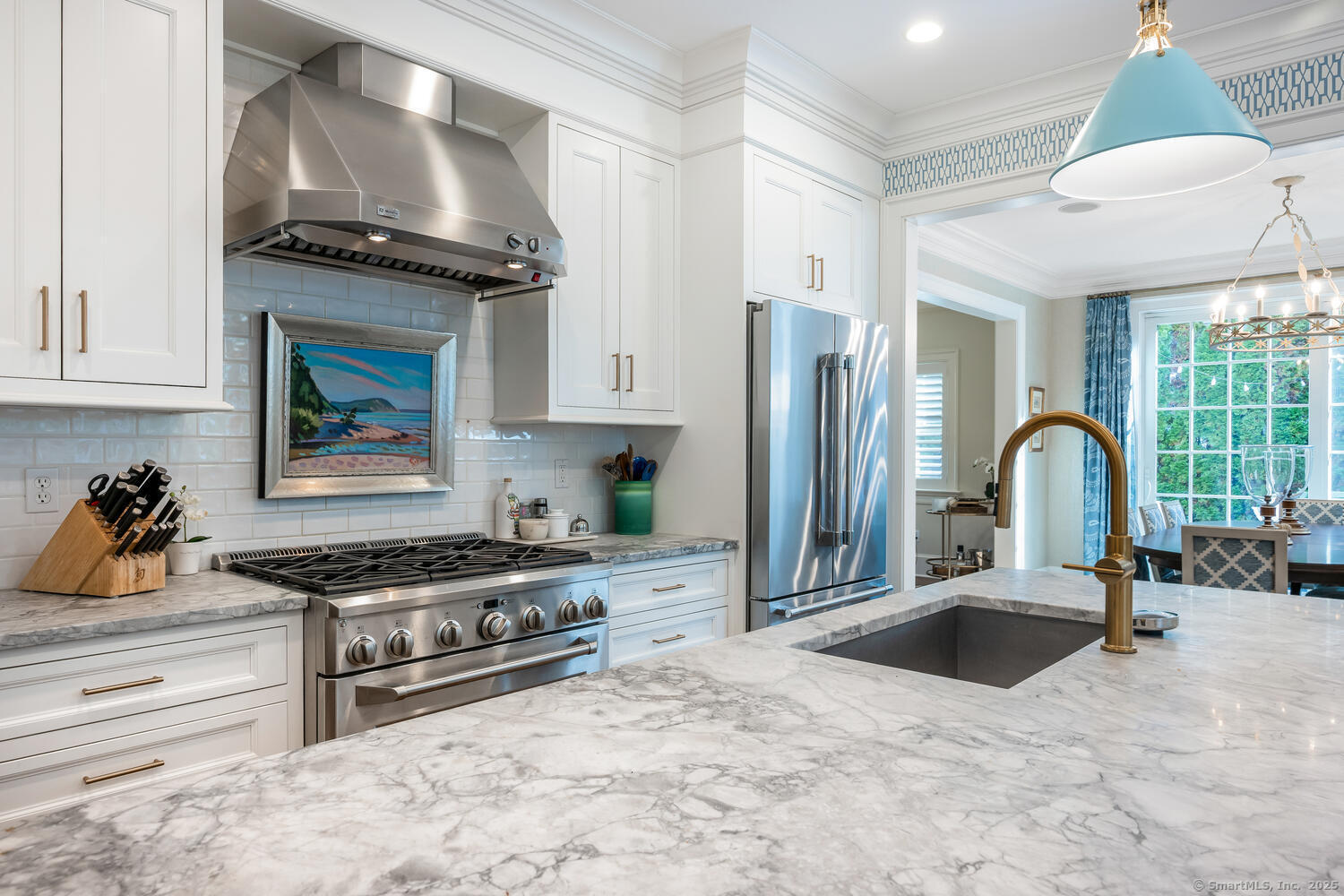 333 West Avenue, Unit 3 Darien, CT 06820 - Photo 14 of 38 a kitchen with stainless steel appliances granite countertop a stove a sink and a granite counter tops with white cabinets