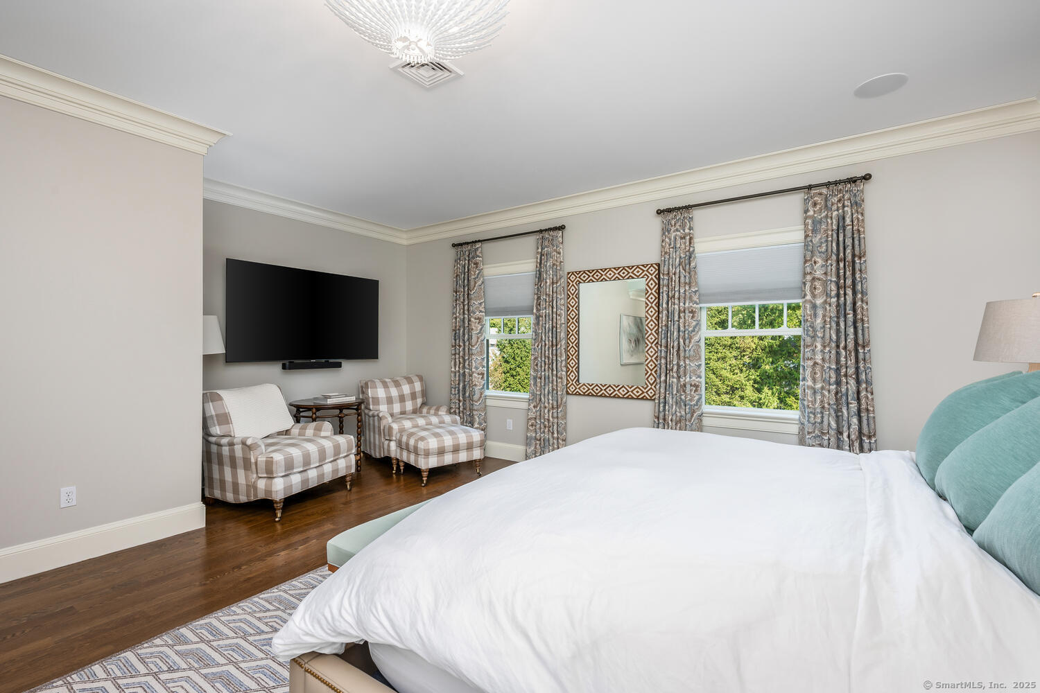 333 West Avenue, Unit 3 Darien, CT 06820 - Photo 19 of 38 a bedroom with a bed and large flat screen tv