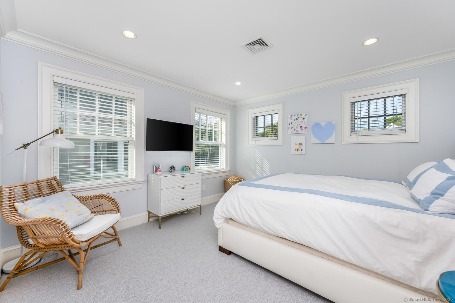 333 West Avenue, Unit 3 Darien, CT 06820 - Photo 24 of 38 a bedroom with a bed and a flat screen tv