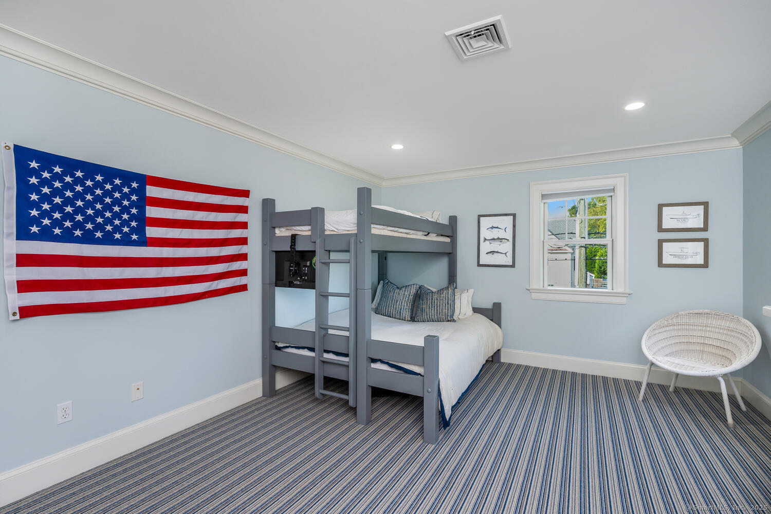 333 West Avenue, Unit 3 Darien, CT 06820 - Photo 25 of 38 a bedroom with a bed and a chandelier