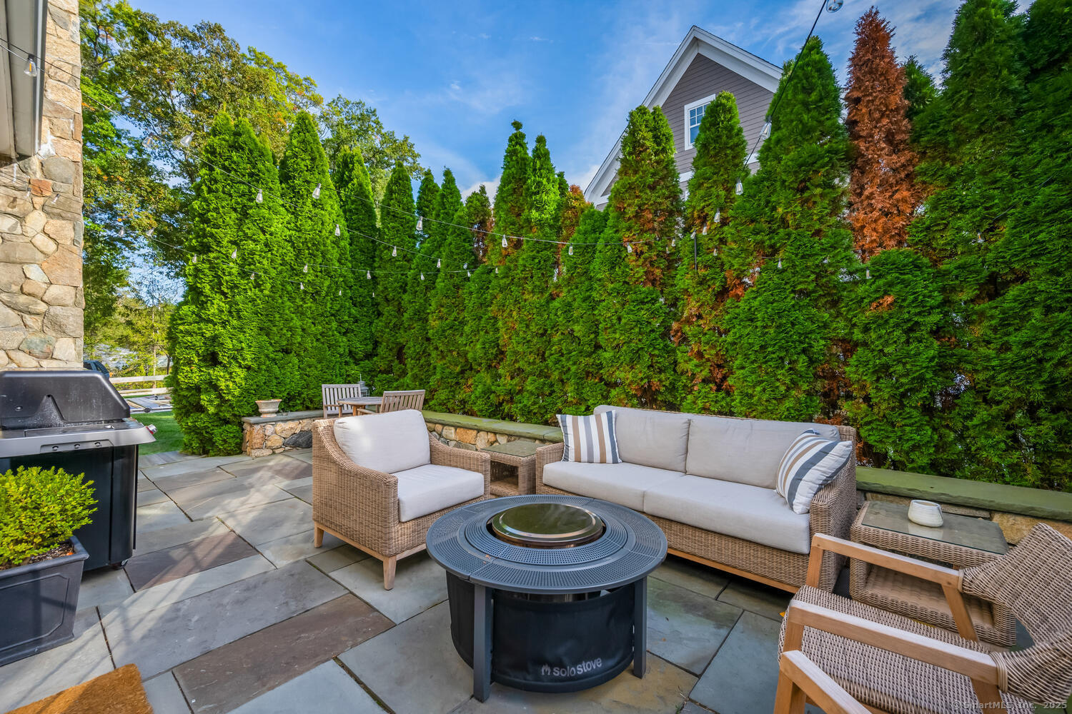 333 West Avenue, Unit 3 Darien, CT 06820 - Photo 32 of 38 a view of a patio with couches and a fire pit