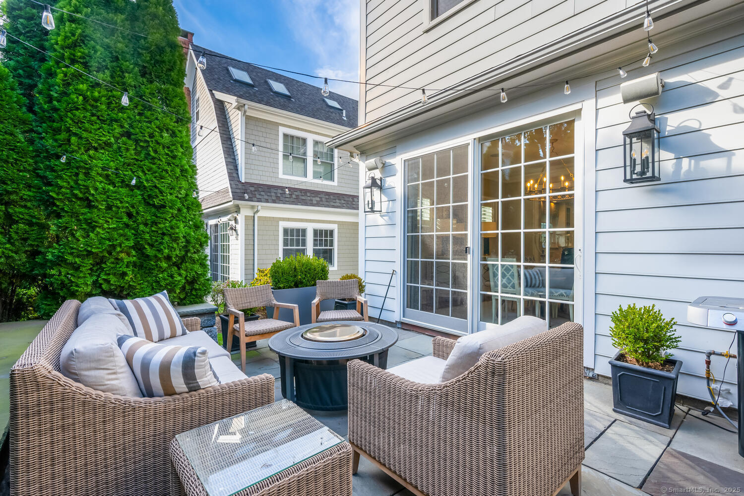 333 West Avenue, Unit 3 Darien, CT 06820 - Photo 33 of 38 a view of a patio with couches chairs and wooden floor