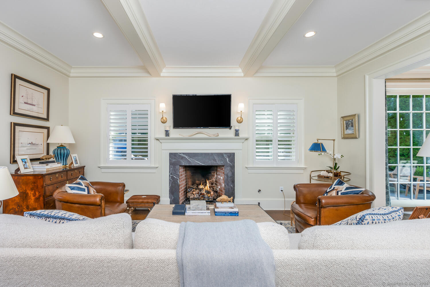 333 West Avenue, Unit 3 Darien, CT 06820 - Photo 4 of 38 a living room with furniture a fireplace and a flat screen tv