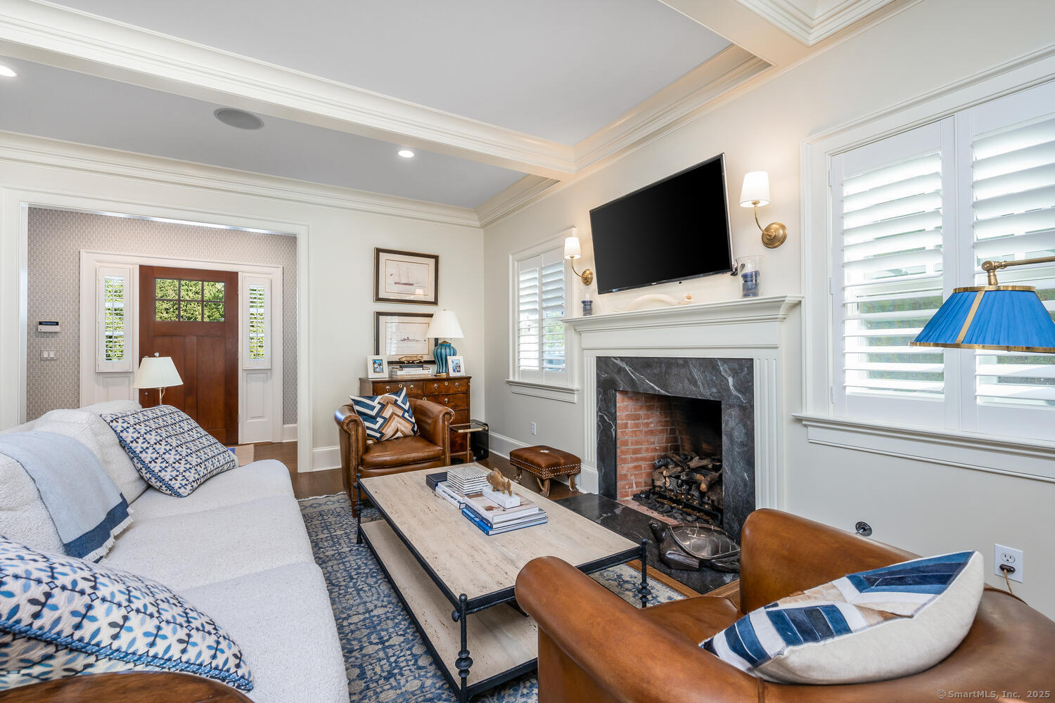 333 West Avenue, Unit 3 Darien, CT 06820 - Photo 5 of 38 a living room with furniture fireplace and flat screen tv