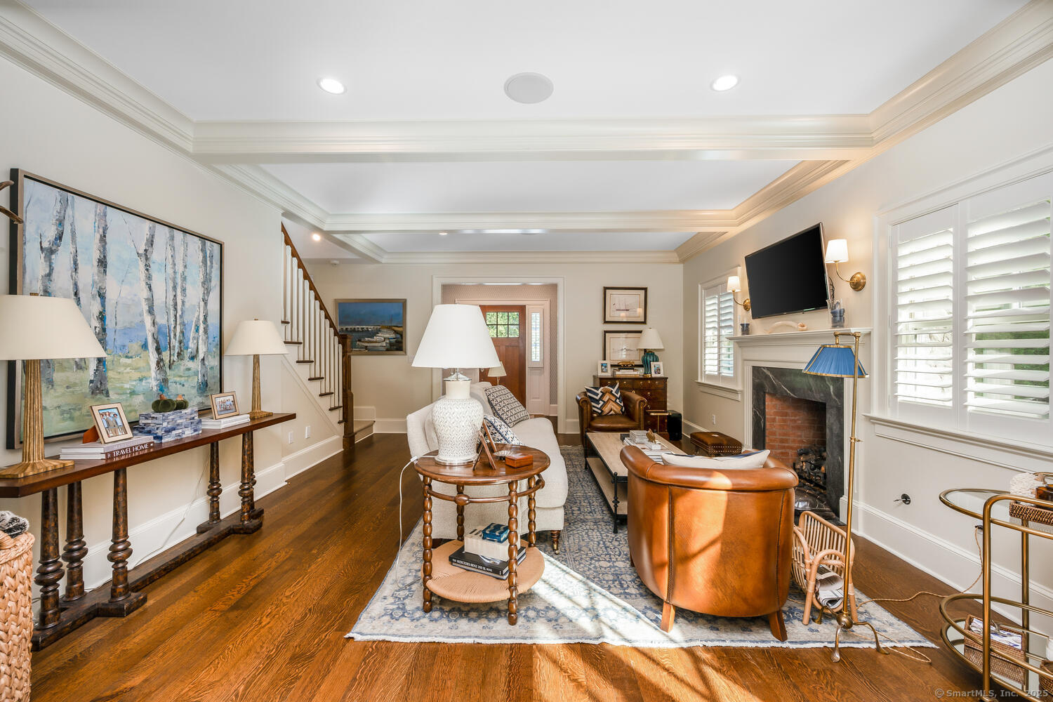 333 West Avenue, Unit 3 Darien, CT 06820 - Photo 6 of 38 a living room with furniture a fireplace and a flat screen tv