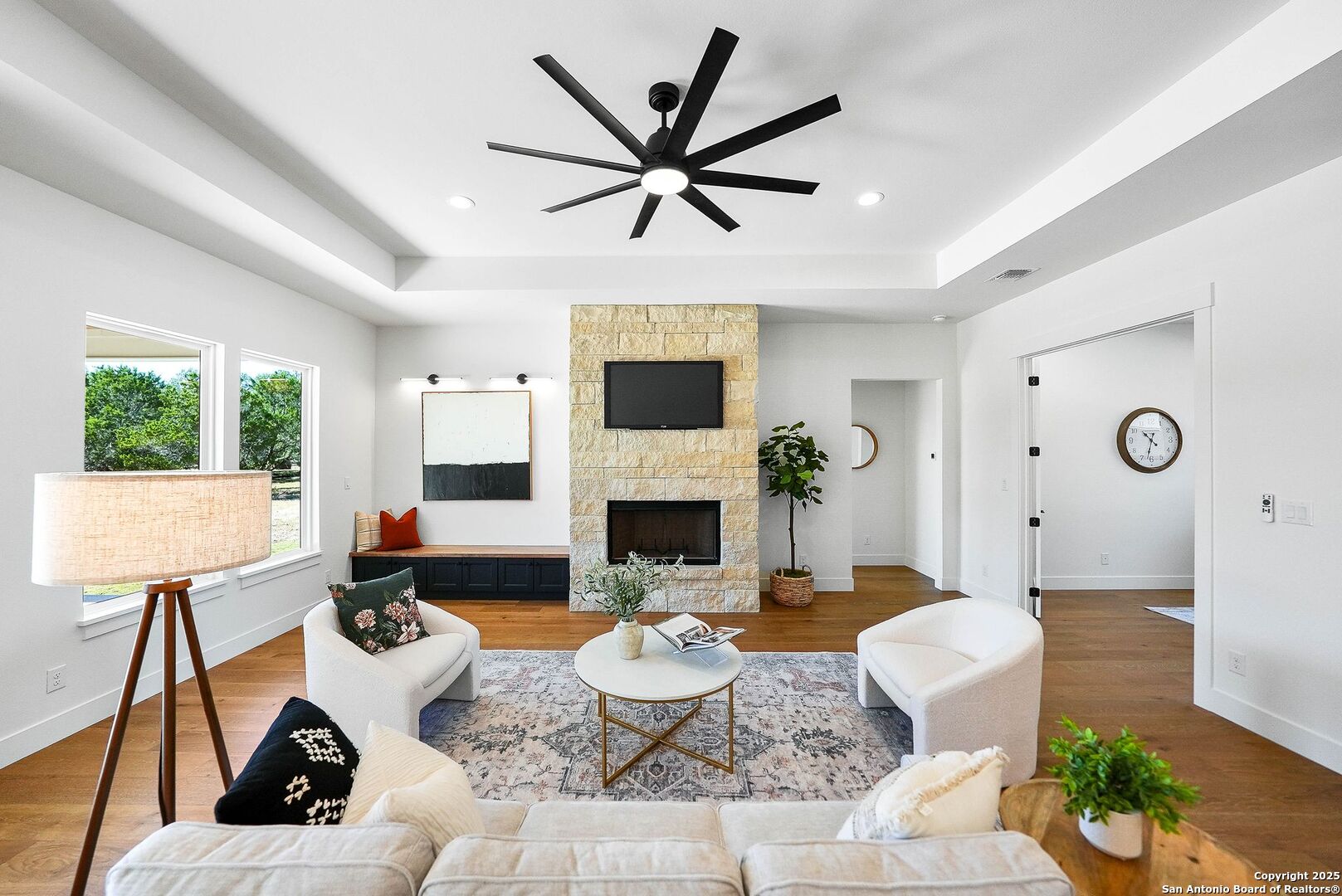 414 Rio Azul Drive Pipe Creek, TX 78063 - Photo 13 of 51 a living room with furniture a fireplace and a large window