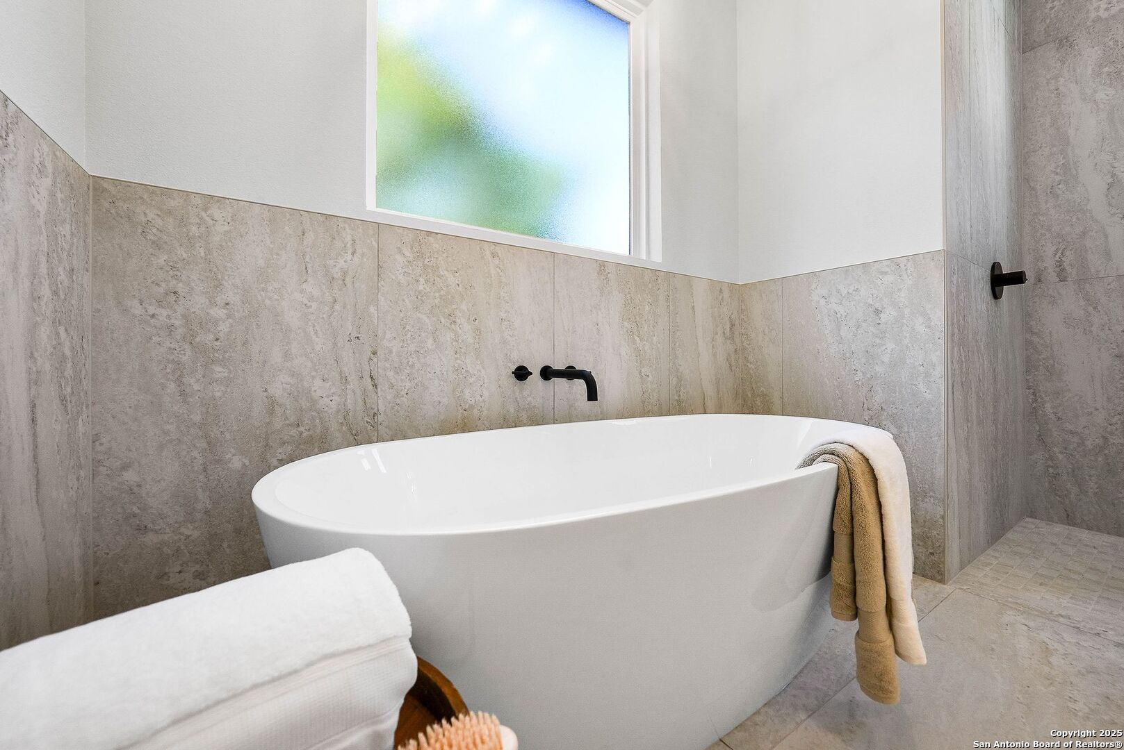 414 Rio Azul Drive Pipe Creek, TX 78063 - Photo 26 of 51 a white bath tub sitting in a bathroom