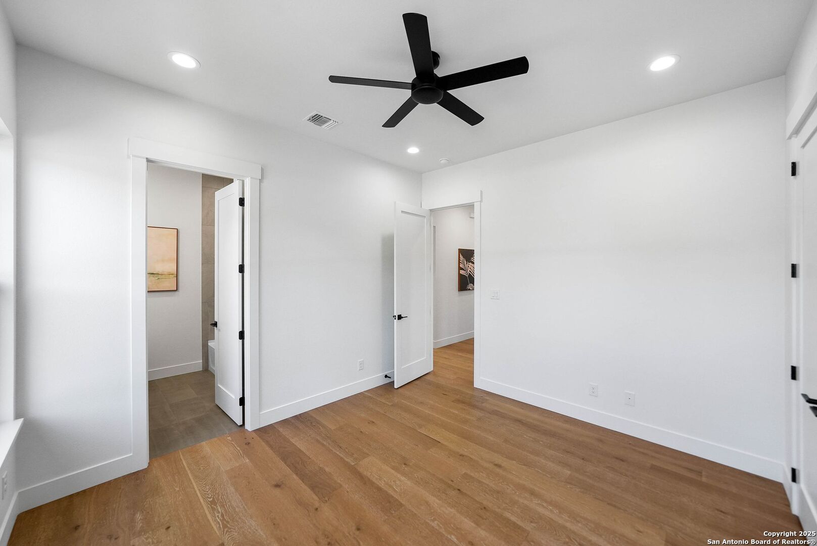 414 Rio Azul Drive Pipe Creek, TX 78063 - Photo 35 of 51 wooden floor in an empty room with a window