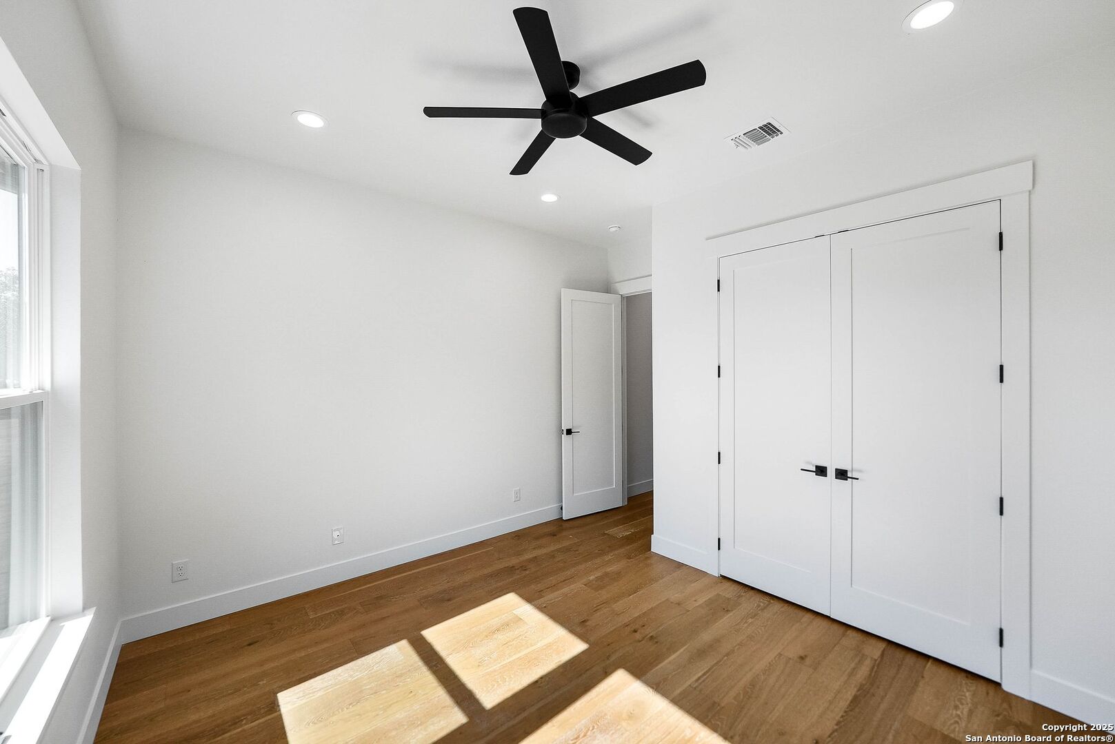 414 Rio Azul Drive Pipe Creek, TX 78063 - Photo 41 of 51 wooden floor in an empty room with a window