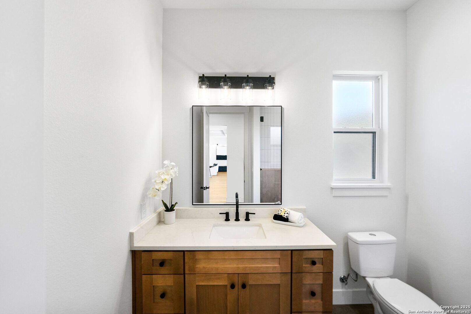 414 Rio Azul Drive Pipe Creek, TX 78063 - Photo 42 of 51 a bathroom with a sink and a mirror
