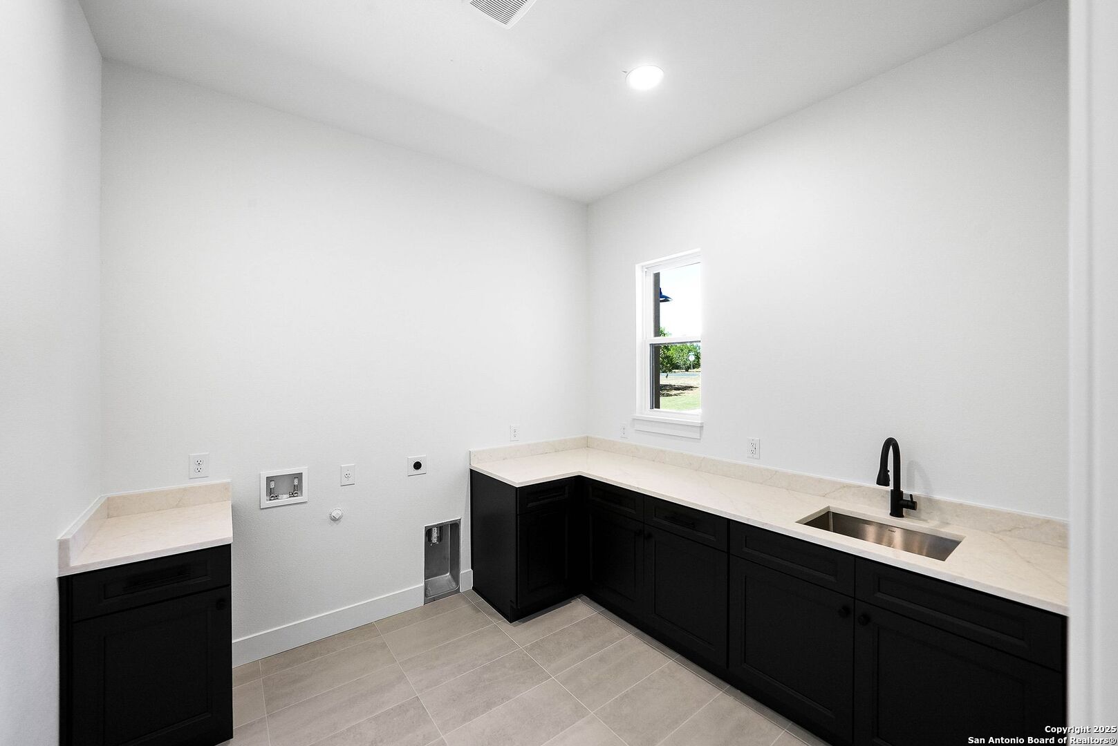 414 Rio Azul Drive Pipe Creek, TX 78063 - Photo 44 of 51 a kitchen with a sink and cabinets