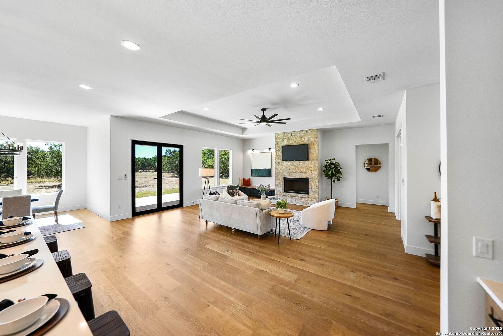 414 Rio Azul Drive Pipe Creek, TX 78063 - Photo 6 of 51 a living room with furniture or wooden floor and a large window