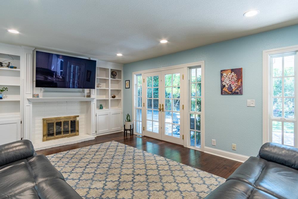 8955 Ridgeway Drive Gilroy, CA 95020 - Photo 18 of 64 a living room with stainless steel appliances furniture a fireplace and a window