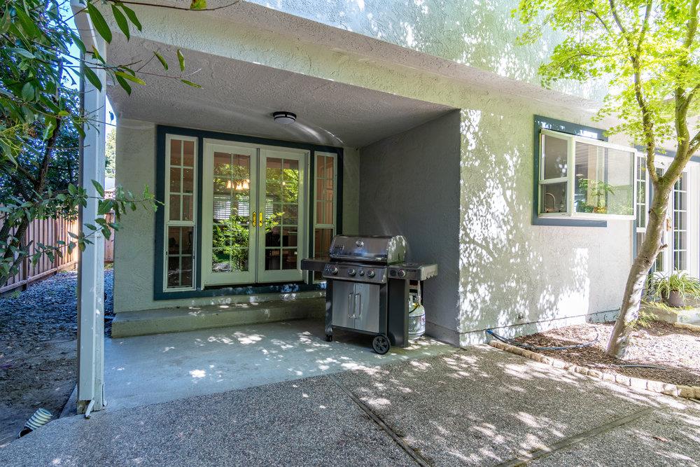 8955 Ridgeway Drive Gilroy, CA 95020 - Photo 42 of 64 a living room with a fireplace and a large window