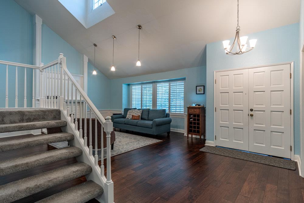8955 Ridgeway Drive Gilroy, CA 95020 - Photo 5 of 64 a view of a livingroom with wooden floor and furniture