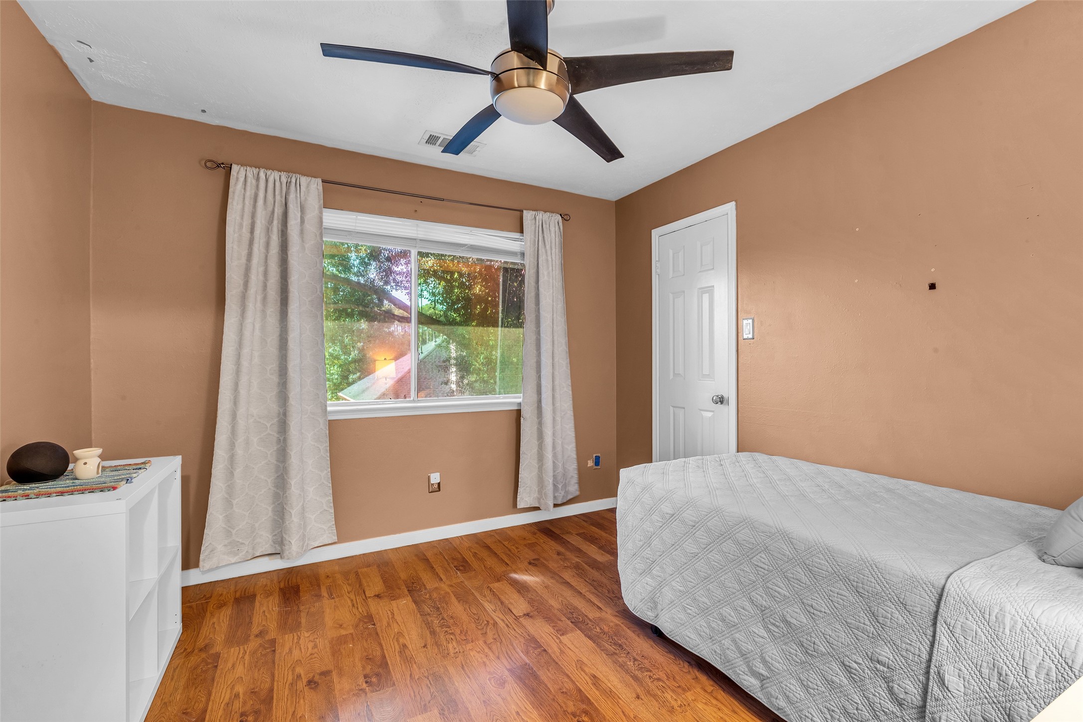 21303 Deerhaven Drive Spring, TX 77388 - Photo 17 of 24 a bedroom with a bed and a window
