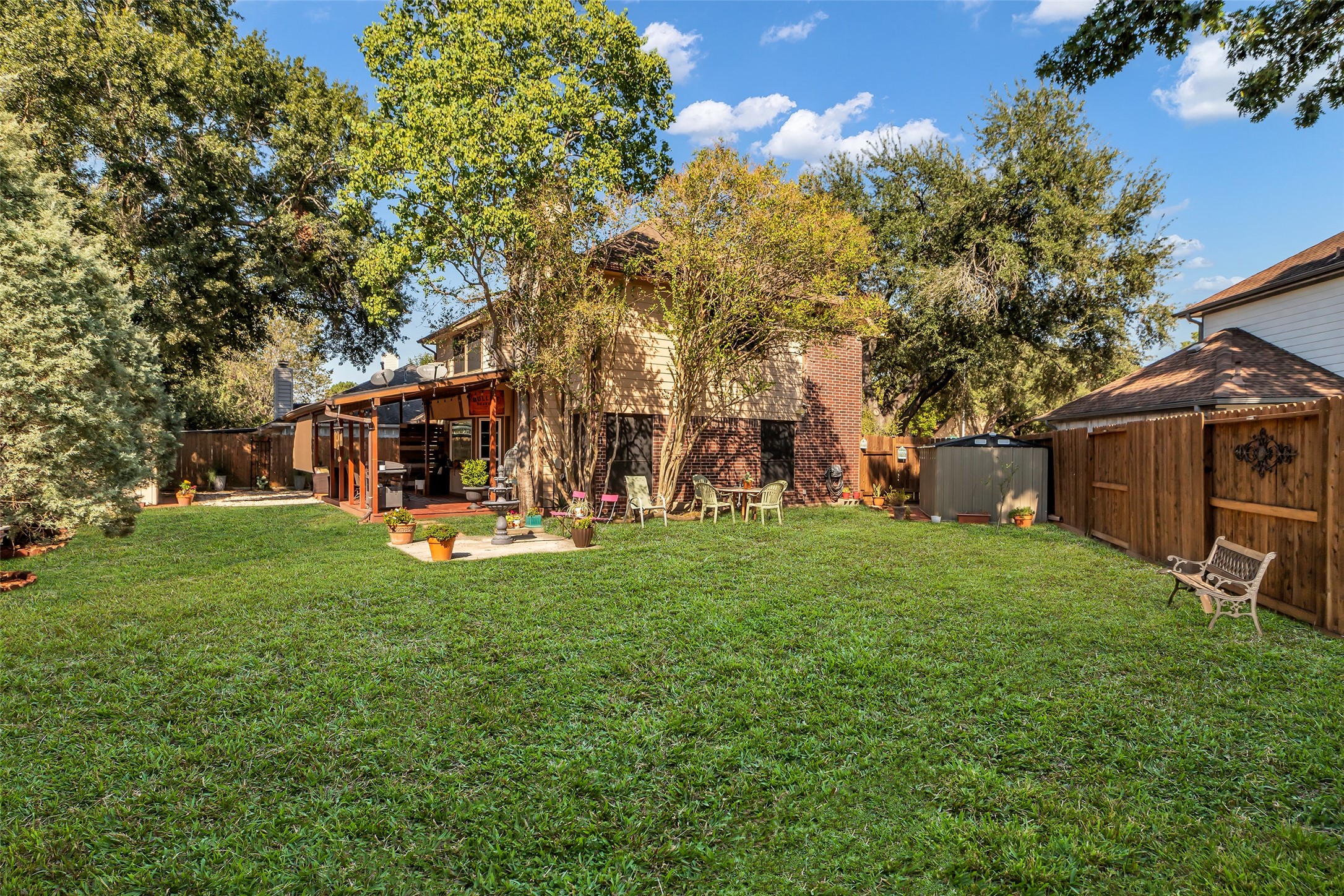 21303 Deerhaven Drive Spring, TX 77388 - Photo 23 of 24 a view of a house with backyard porch and garden