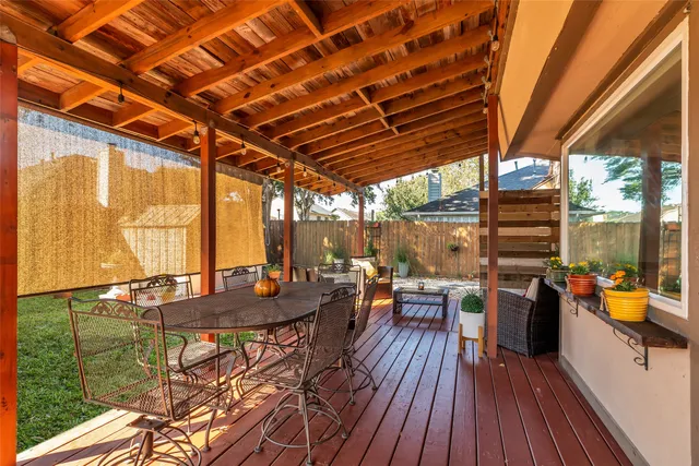 a outdoor space with patio lots of furniture and wooden floor