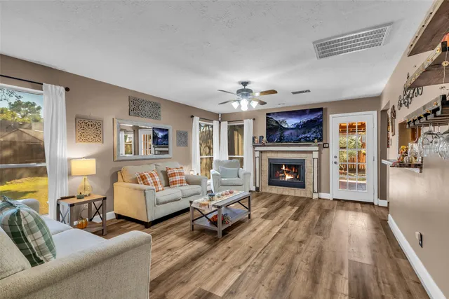 a living room with furniture and a fireplace