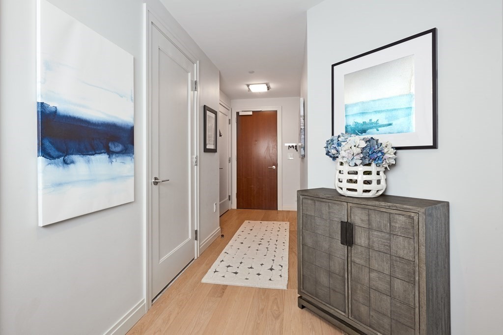 133 Seaport Boulevard, Unit 823 Boston, MA 02210 - Photo 13 of 30 a view of hall way with mirror