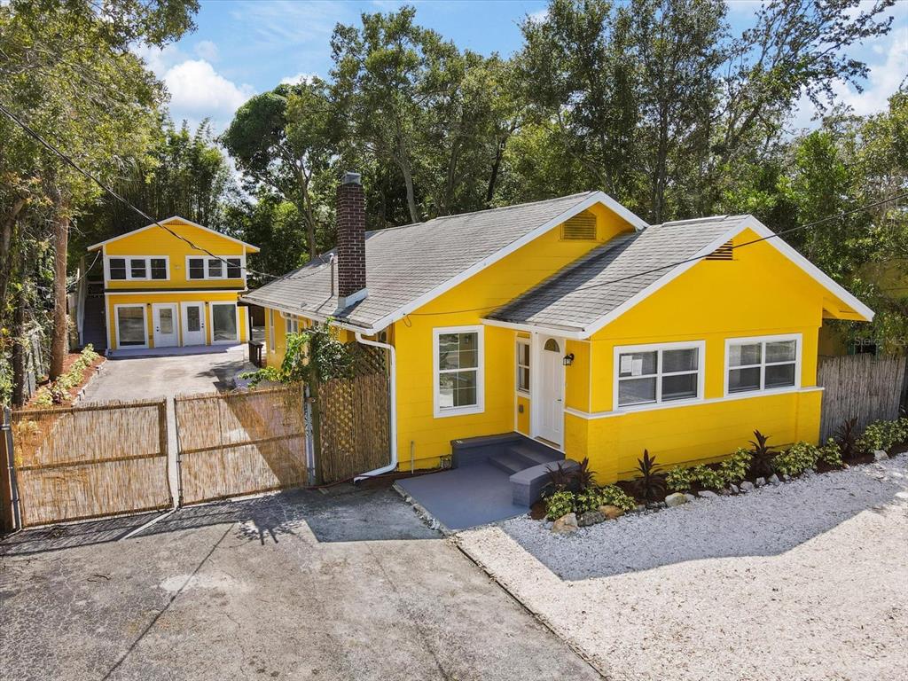909 Druid Road Clearwater, FL 33756 - Photo 1 of 1 a front view of a house with a yard