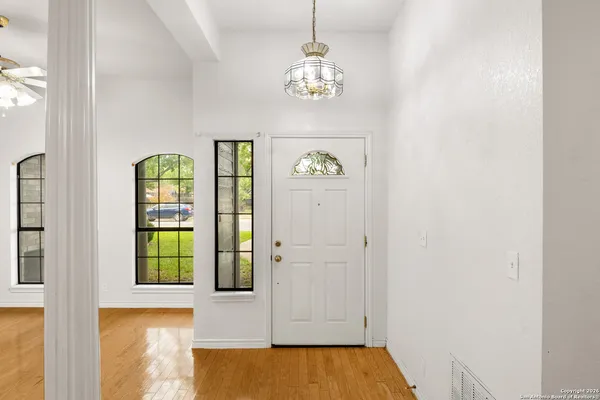 a view of an entryway with wooden floor